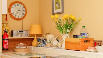 Fridge, electric kettle, toaster, cookware/dishes/utensils