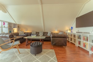 Standard Apartment | Living area | 40-inch flat-screen TV with satellite channels