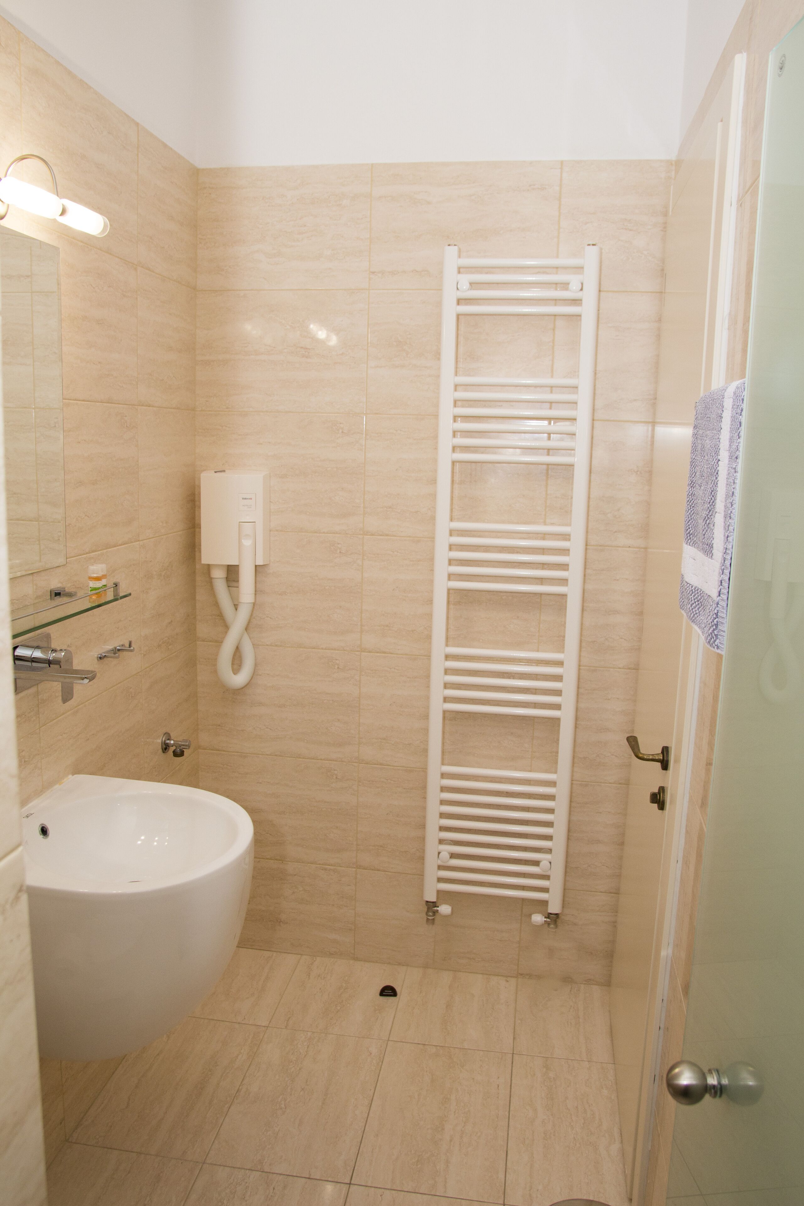 Shower, rainfall showerhead, hair dryer, towels