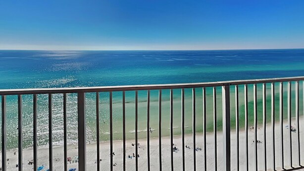 A balcony with a view of a beach and ocean. - Tidewater Beach Resort by Resort Collection (Panama City Beach)