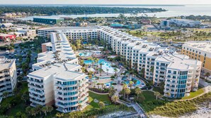 A resort with multiple buildings, a central pool area, and a beach. - Waterscape by Southern Vacation Rentals (Fort Walton Beach)
