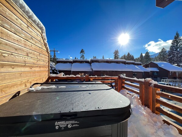 Escape to a serene mountain retreat with a deck and breathtaking views.