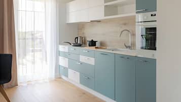 Apartment (26) | Private kitchenette | Fridge, stovetop, electric kettle, cookware/dishes/utensils