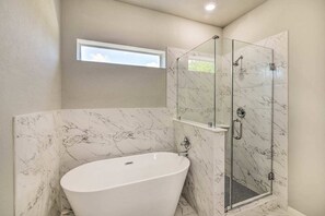 Bathtub, hair dryer, towels, soap