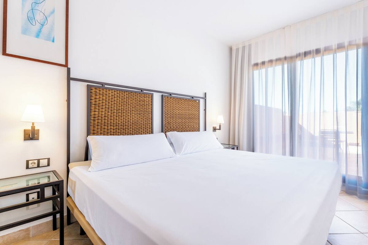 Premium bedding, down comforters, Select Comfort beds, in-room safe