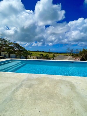Outdoor pool - One bed apartment with expansive ocean view  (Four Hill)