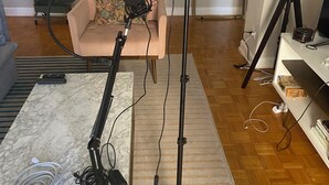 A room with a microphone on a stand, a ring light, a sofa, and a lamp. - 21 first floor cozy condo in the center of DT Atlanta (Atlanta)