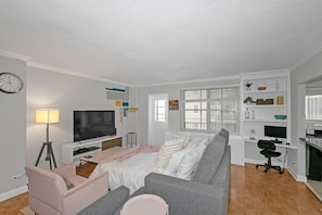 1 bedroom, desk, iron/ironing board, travel crib