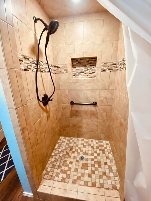 Bathtub, hair dryer, towels, soap
