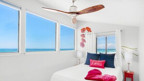 A bedroom with a large bed, a ceiling fan, and a view of the ocean. - 🌟  Spectacular Sunset Views-Gulf Front-XL Balcony-Pool-Nautical Watch A-11🌟 (Panama City)