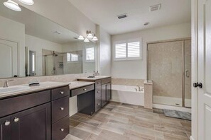 Combined shower/tub, hair dryer, towels, soap