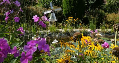 Vacation apartment with relaxation experience in the garden with terrace