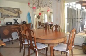 Enjoy meals in this stylish dining area with a round table and six comfortable chairs.