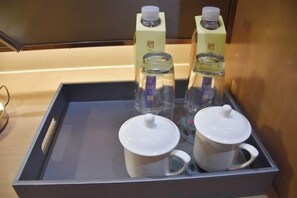 A tray with two white mugs and two glass bottles with white lids, likely containing beverages. - Luxinan Hot Spring Hotel (Heze)