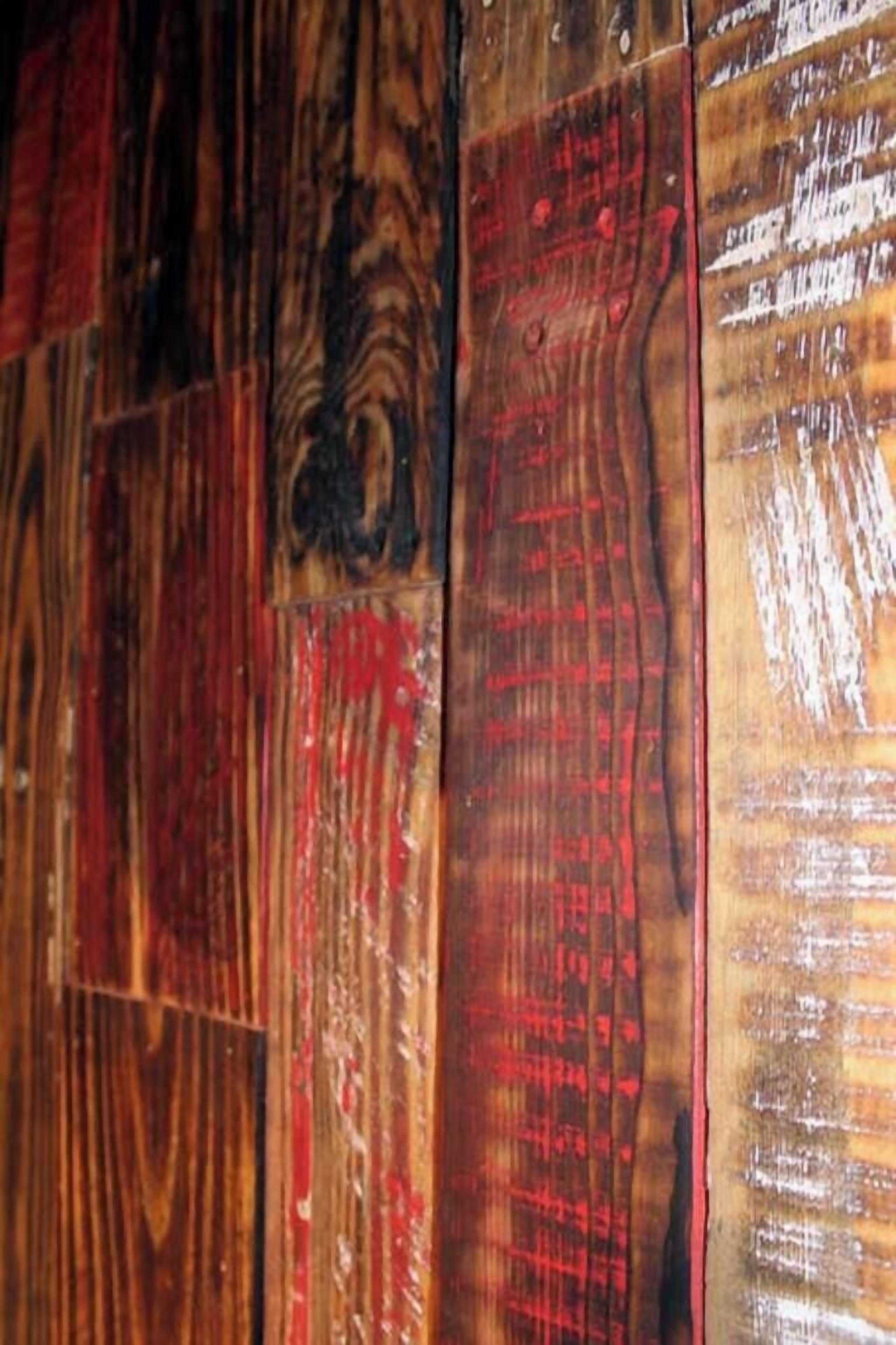 A close-up of a wooden floor with various patterns and textures.