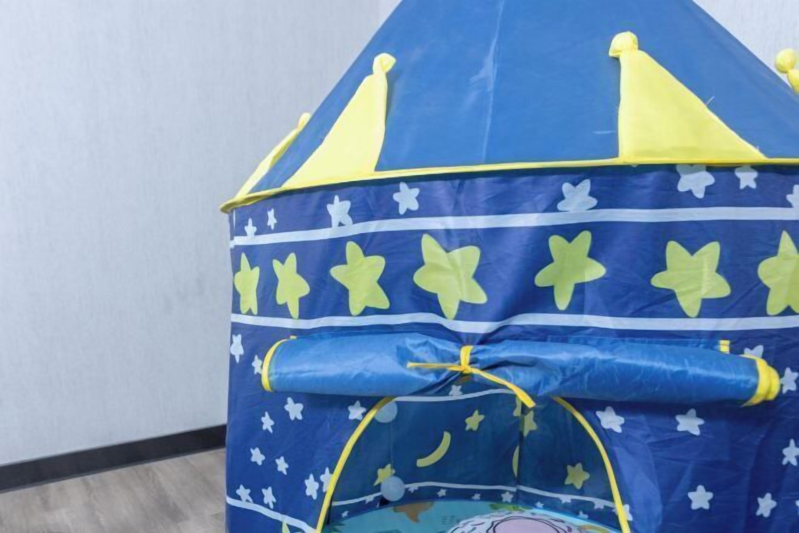 A blue and yellow tent-like structure with star and moon patterns.
