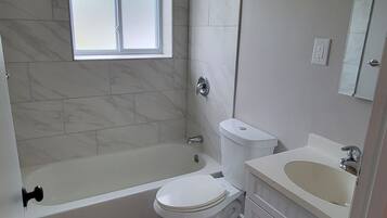 Combined shower/tub, towels, soap, toilet paper