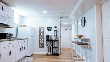 Fridge, microwave, stovetop, coffee/tea maker