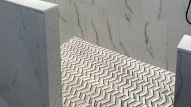 A modern bathroom with marble walls, a patterned floor, and a ventilation system. - Conveniently located 2brm / 1bt Home (Myrtle Grove)