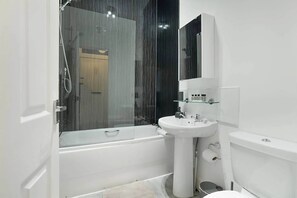 Bathtub, hair dryer, towels