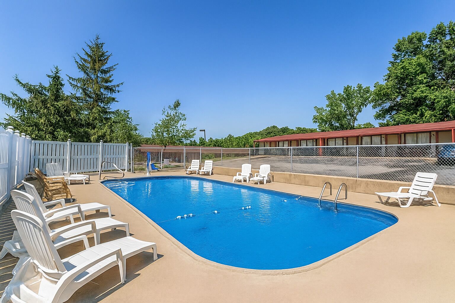 Dive into sunshine and lounge poolside on crisp chairs.