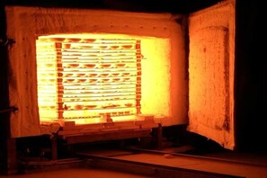 A brick oven with a metal rack inside, possibly for baking. - Very Much Pottery Homestay (Fuliang)