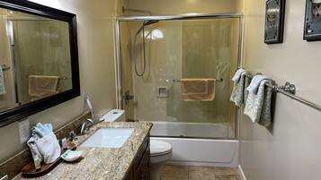 Combined shower/tub, hair dryer, towels, soap