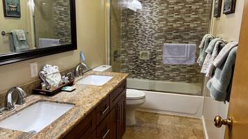 Combined shower/tub, hair dryer, towels, soap