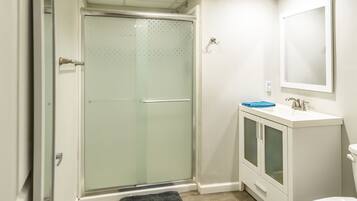 Shower, towels, soap, toilet paper