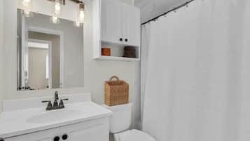 Combined shower/tub, hair dryer, towels, soap