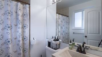 Combined shower/tub, hair dryer, towels, soap