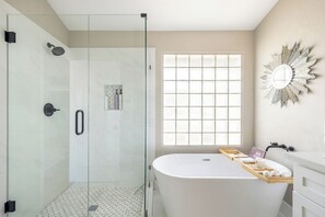 Bathtub, hair dryer, towels, soap