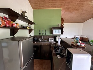 Fridge, microwave, stovetop, coffee/tea maker