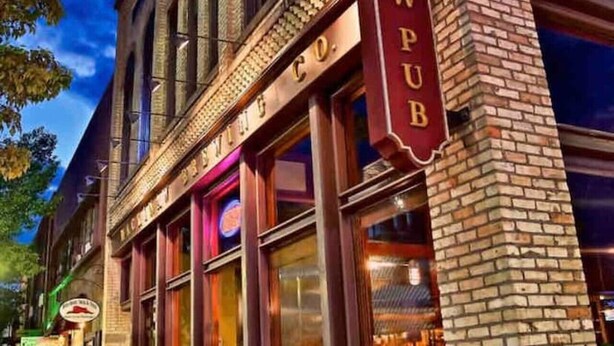 A brick building with a sign reading "BREWPUB".