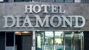 A hotel sign with the name "HOTEL DIAMOND" in large letters. - Hotel DIAMOND (Tokyo)