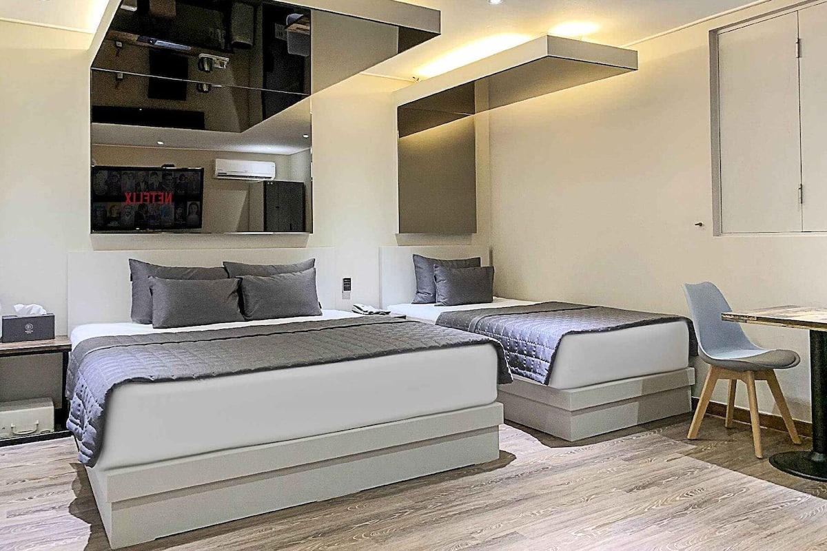 Premium bedding, down duvets, memory-foam beds, desk