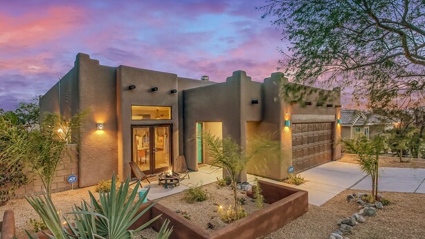 A modern house with a garage, outdoor seating, and a landscaped garden. - House Rising ☀️ Villa w/ mini-golf, pool and spa (Desert Hot Springs)