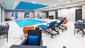 A swimming pool area with lounge chairs and a blue ceiling. - Hampton Inn & Suites Canyon (Canyon)