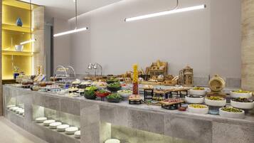 Una mesa de buffet con diversos alimentos y utensilios.