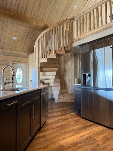 Beautiful hand-crafted log cabin on Horse Creek one block off Main Street.