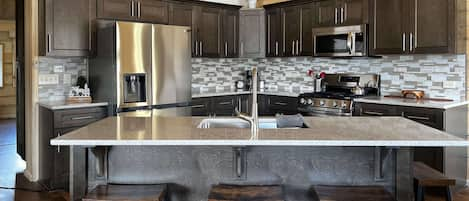 Kitchen with large island and seating for 4.