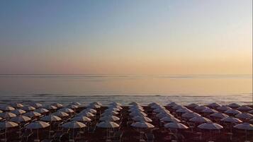 Sun-loungers, beach umbrellas