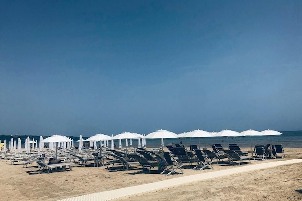 Sun loungers, beach umbrellas