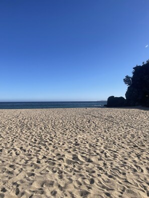 On the beach, sun-loungers