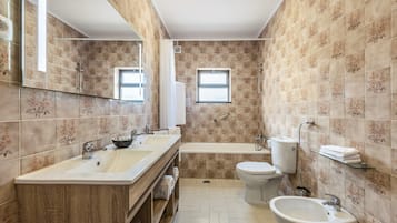 Bathtub, hair dryer, towels