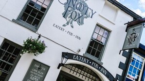 A building with a sign reading "Snooty Fox" and "EATERY PUB INN" indicating it is a pub and restaurant. - The Snooty Fox (Carnforth)