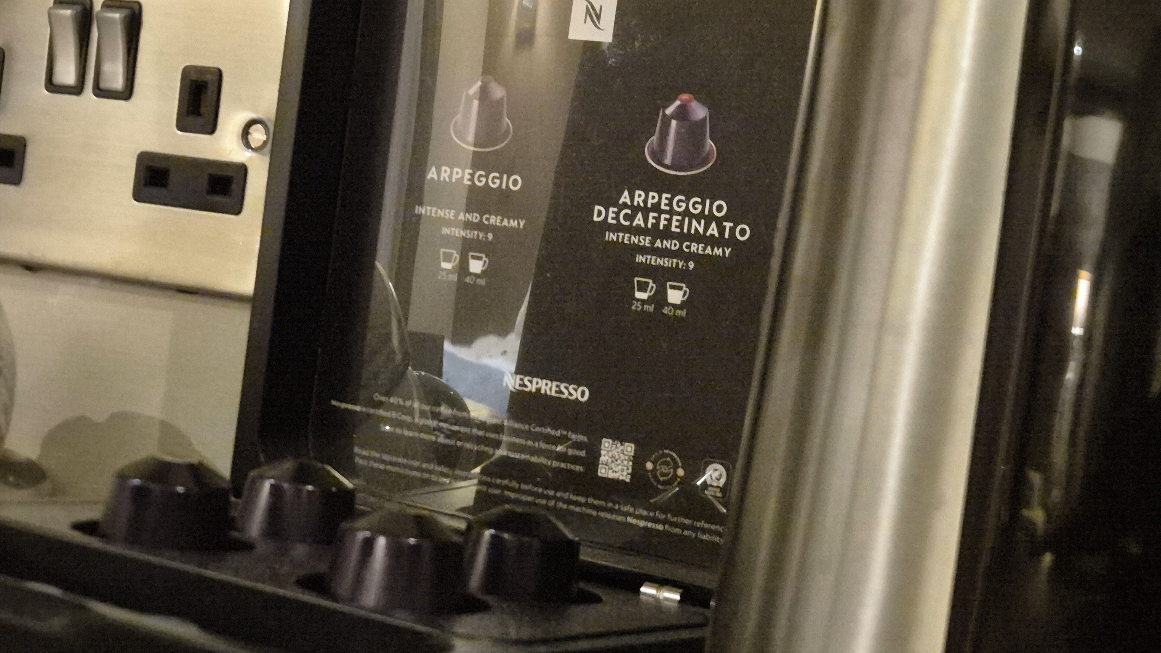 A coffee machine with two coffee options, Arpeggio and Arpeggio Decaffeinated, both with an intensity of 9.