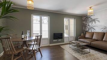 Refurbished Apartment in Traditional Neighborhood | Living area | 22-inch flat-screen TV with cable channels