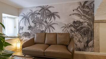 Cozy Apartment with Interior Terrace | Living area | 22-inch flat-screen TV with cable channels