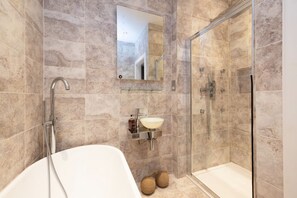 Bathtub, hair dryer, towels